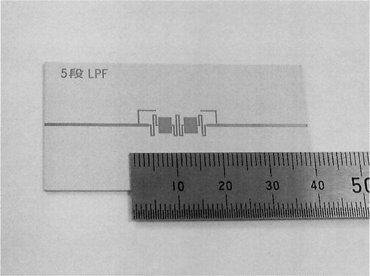 The high impedance lines are folded into meander lines to reduce the length of the filter. Fig. 6 Comparison of measured and simulated responses of the 3-pole filter in Fig. 4.