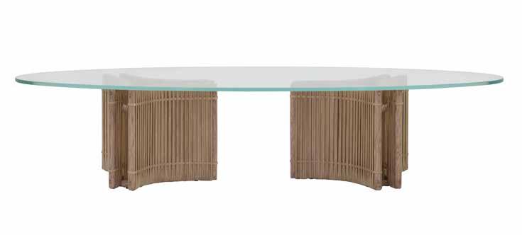 862 Estrella Cocktail Table w64", d26", h14" Two woven rawhide and rattan bases with oval ultra clear glass top.