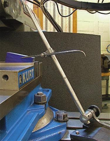 504 Section 6 Milling Positioning the Workpiece in a Workholding Device To machine to an angled layout line, the workpiece can be lightly clamped in a vise or against an angle plate.