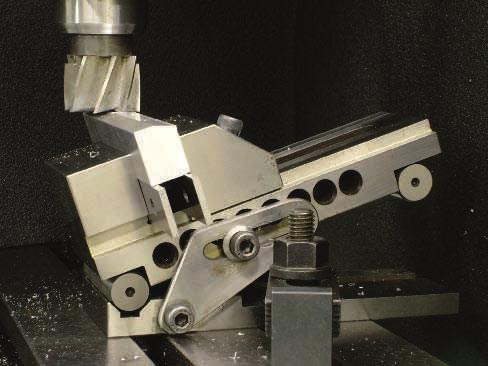 506 Section 6 Milling FIGURE 6.3.64 Face milling an angular surface of a workpiece held in a sine vise directly clamped to the machine table.