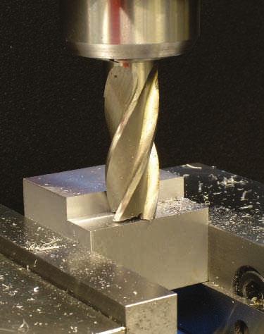 Unit 3 Vertical Milling Machine Operations 509 A Key C Keyseat FIGURE 6.3.71 (continued) In (C), a final climb milling pass is being machined to finish the step. Only about 0.