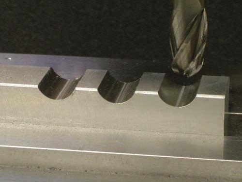 An open pocket breaks through at least one edge of the workpiece while a closed pocket is completely contained within the outer edges of the workpiece. Figure 6.3.