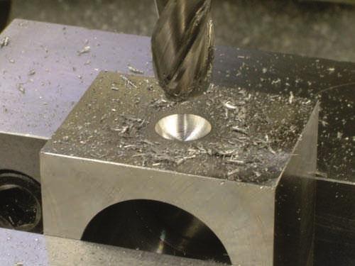 (B) A spherical depression machined with a ball endmill. All images B FIGURE 6.3.92 Examples of (A) open pockets, and (B) closed pockets that can be machined on the vertical mill.
