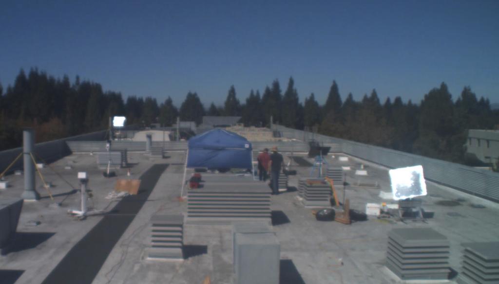 View from the uppermost camera on our roof lab, with two heliostats visible and on target.