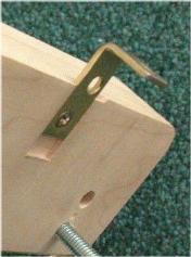 Note that you have to provide good backing for the laminate when drilling this hole, otherwise the bit tears through the laminate on the far side and spoils an otherwise perfectly good surface.