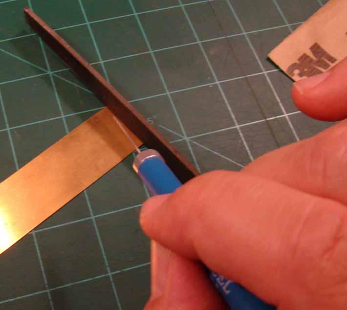 Creating and Installing the Brass Soldering Strips The first step is to take the same file you used to create the slots on the throw-bar and use it to mark your brass sheet so the brass strip is the