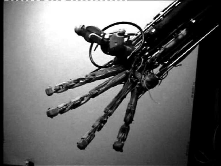 a physical humaniform hand with 24 axes of motion replicating those of the human hand as far as possible.