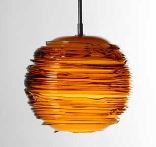 The amber color is layered over an opaque white interior. Hand blown, no two exactly alike. Bulb Included.
