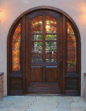 exterior doors Custom arched front entry unit with sidelights made with reclaimed Douglas Fir, antique grillwork, antique carved