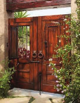Door is constructed with antique carved panels, reproduction hardware and reclaimed Douglas Fir.