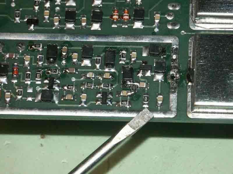 This area has a shield covering Q17 and the access point. 8. Remove the shield by unsoldering the tabs at each end and carefully lifting the shield upward.
