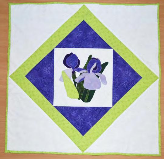 In addition a tutorial for making a binding using the quilt backing is included in this project. per is 20 1/4 square.