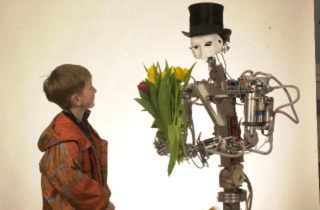 Figure 1: The humanoid robot ARMAR: buddy and servant in the everyday world.