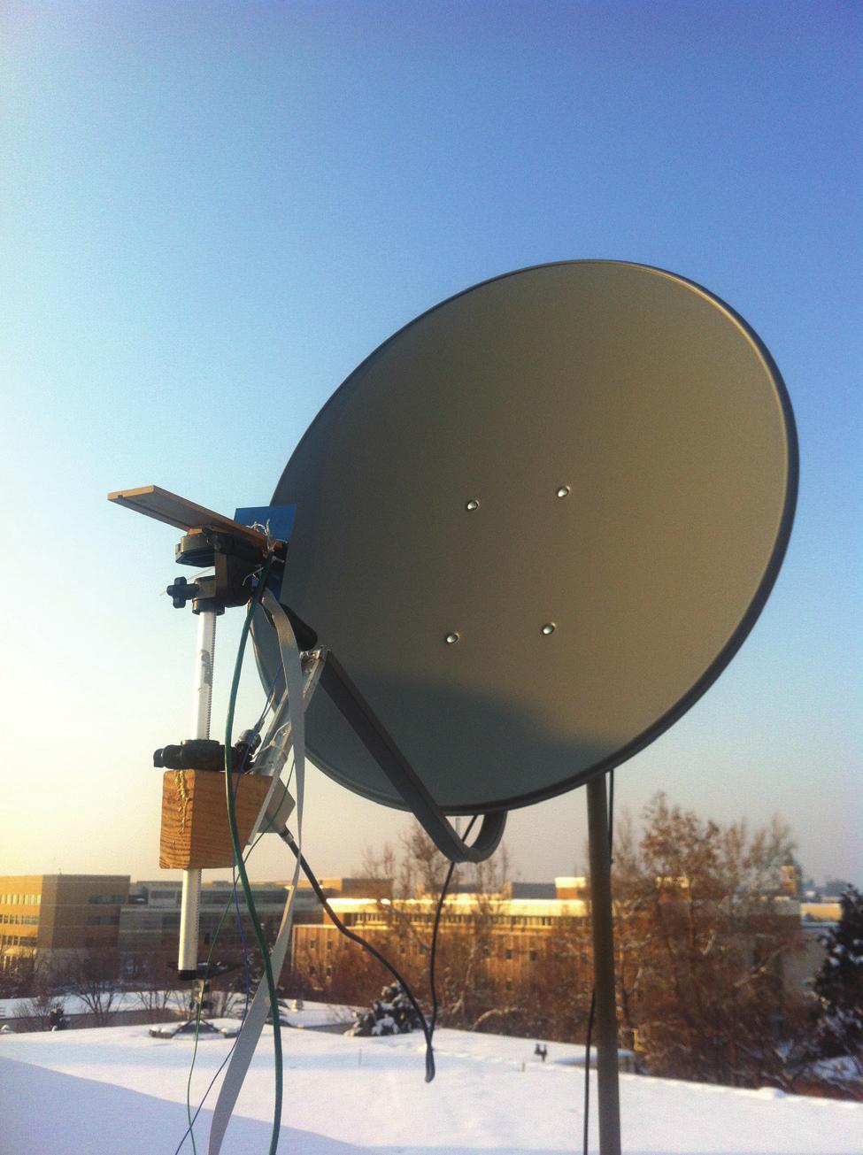 Figure 3.7: The ESAF system attached to a dish. Shown in the picture is the board with the antenna array feed, LNAs, and VGAs.