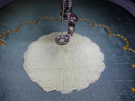Continue stitching until the design is complete. Remove the hoop from the machine and the fabric from the hoop.