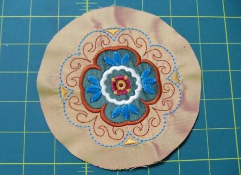 Appliqué the circle to the pillow front using a blanket stitch and Open Embroidery Foot #20/20C/20D.