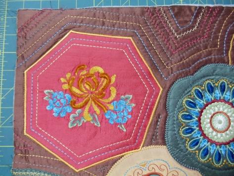 BO01704 (upper left) Embroider the design on the 10 x 14 rectangle of terracotta silk, changing color #1921 to #4111, and color #2022 to #4116.