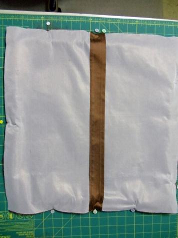Cut the buttonhole open with a buttonhole cutter and block.