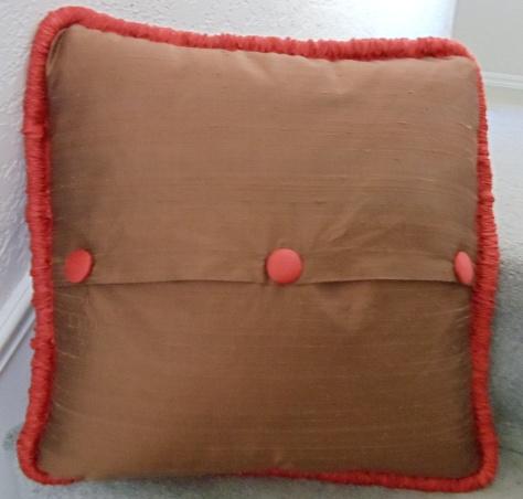 Temporarily pin in place, placing the pins perpendicular to the pillow edges for easy removal (the pillow will be stitched