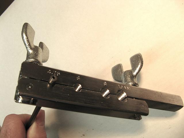 figure 5 - Forming Bar Tighten the wing nut closest to the line first.