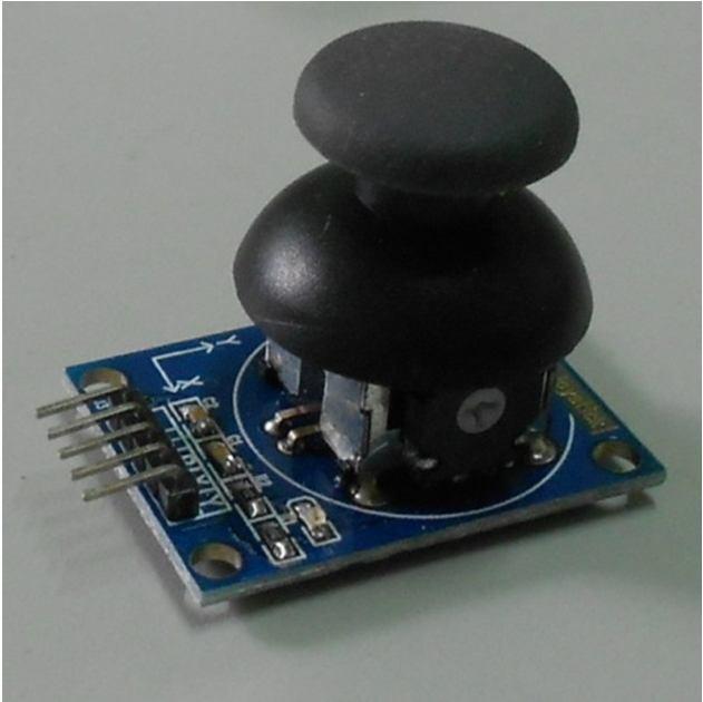 Figure-6. 2 axis Joystick module with push button function. The joystick module is fairly straight forward to use. following: It has a 5 pin interface, as 1. Vcc (5V) 2. GND (Ground) 3.