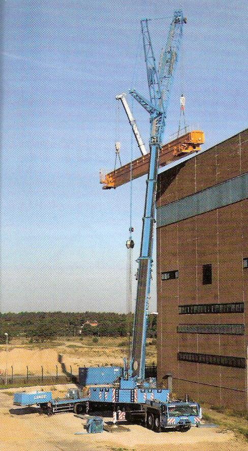 TWO CRANES MAKING A HIGH LIFT
