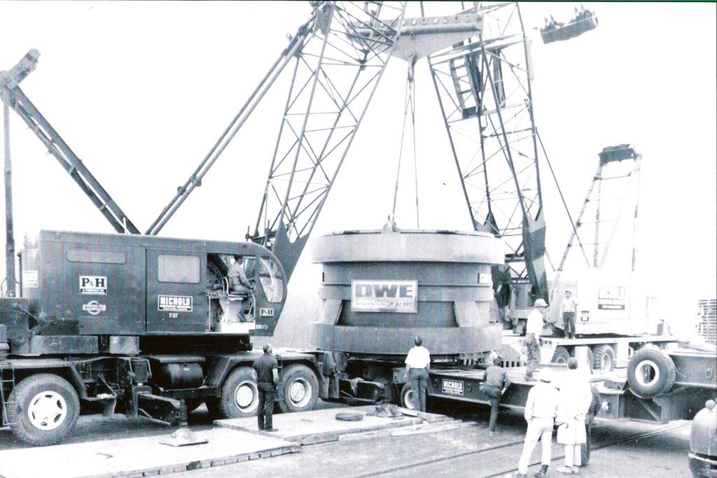 TWO UNMATCHED CRANES CONNECTED BY AN INVERTED LIFT BEAM-