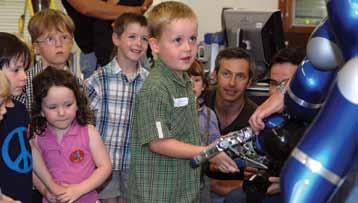 DLR s humanoid robot, Justin, demonstrates dexterous tool handling. Robotics demonstration DLR s Justin greets the next generation.