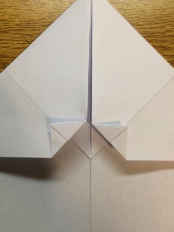 triangles that meet at the center crease. 6.