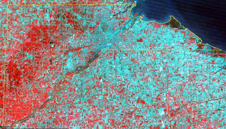 (b) Georectified landsat5 image overlays perfectly with lucas county boundary Figure 3 Georectification brings geometric accuracy to an image.