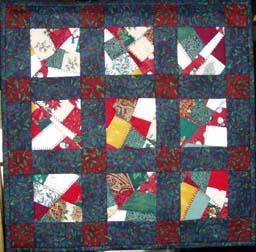 This quilt has tiny squares in the sashing, and four corner