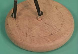 I insert a 3/8 piece of dowel into the center hole to make it easier to set the compass point. 10.