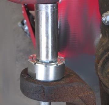 6.8: Fill the upper ball joint with grease until it starts to come out of the hole next to the seal (Fig 42). Figure 38 6.