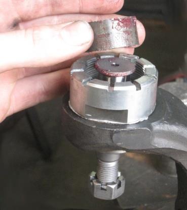 Disassembly of Upper Ball Joint Figure 4 2.4: There is a spacer bushing inside of the ball joint cup.