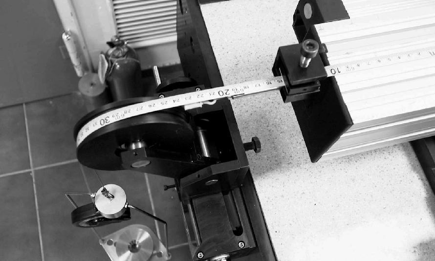 The system magnification is (5 ) The operator can perform the probing process by simply translating the camera over the scale marks using the X-Y table micrometer.