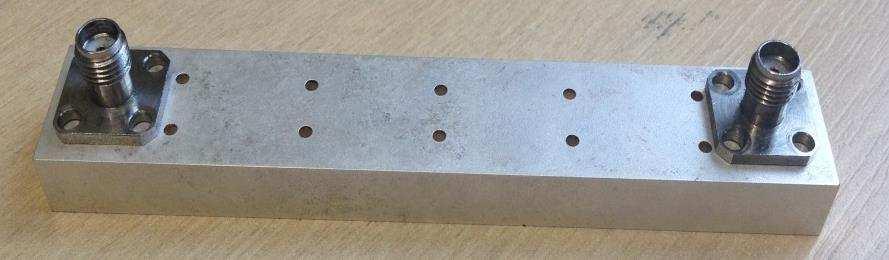 Figure 5. Fabricated six pole Chebyshev ceramic waveguide filter 4.