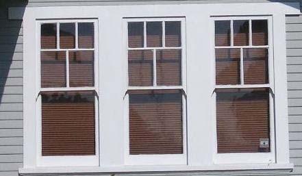 flanking one large double hung window with 15
