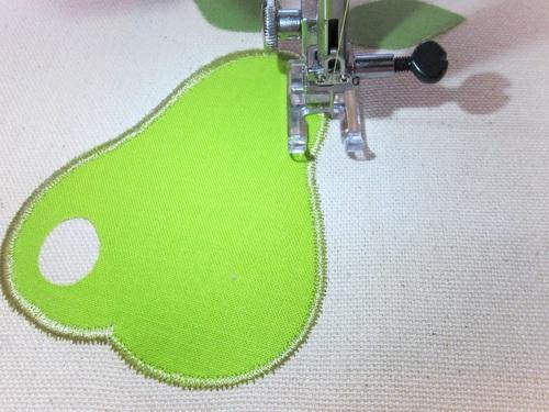 The second round of zig zag is the finishing satin stitch. Set the machine for a tighter stitch (we used 3.5 mm width, 0.