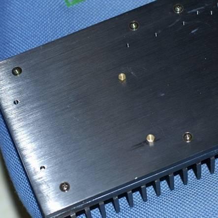 Now, I placed the amplifier board to the heat sink, there are many holes, I use the 4 holes at 4 corners of PCB to find out any holes fit.