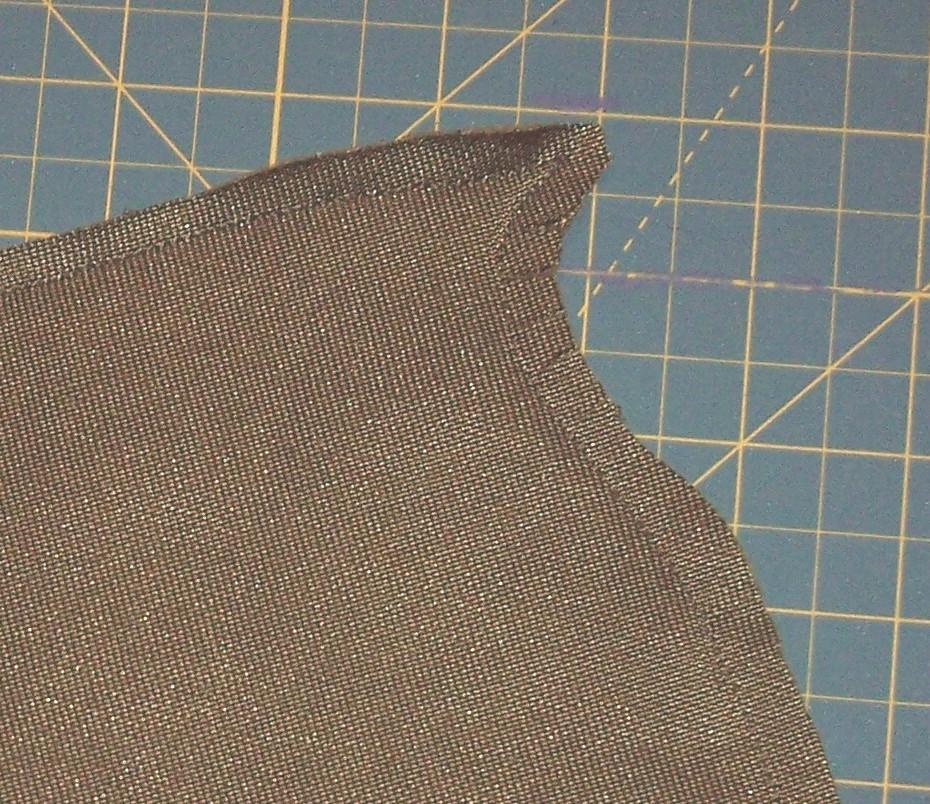 Snip the edge of the seam a few times on the back side at the top. Do not cut threw seam.