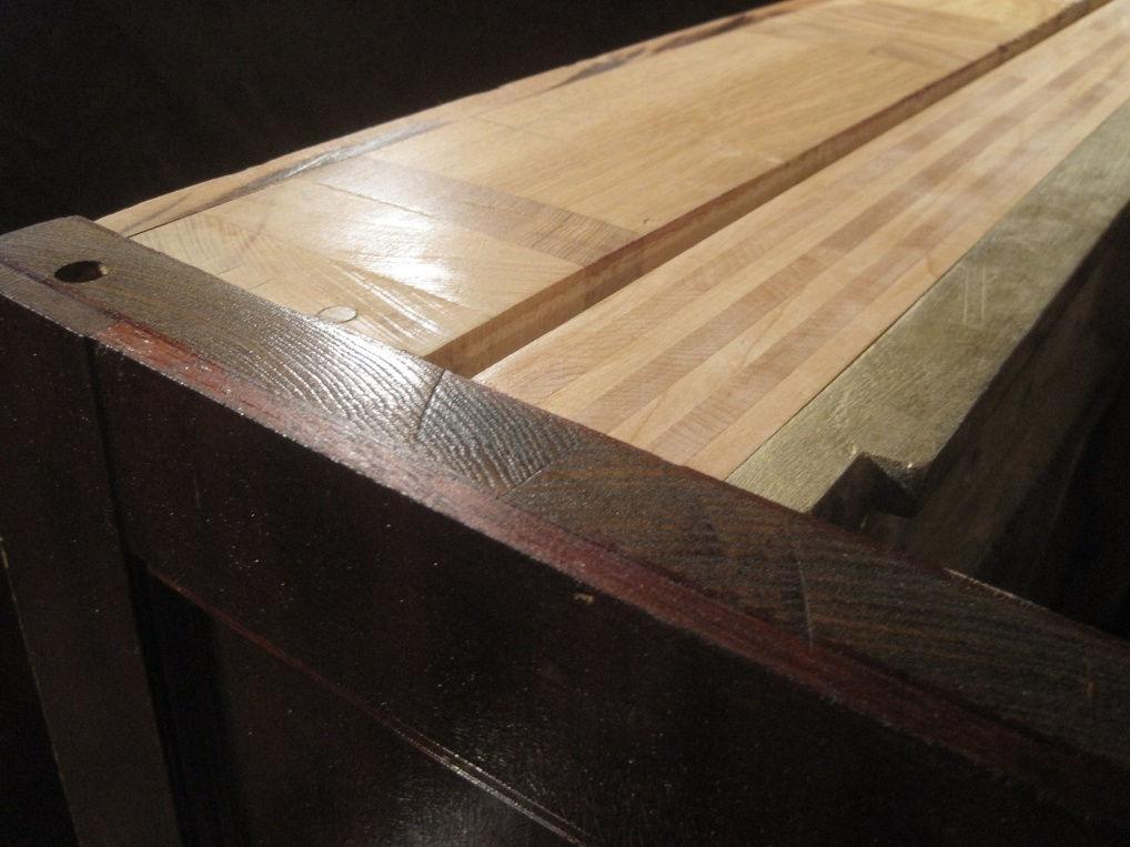 The back structure of the vertical piano needs to be rock solid in order to hold the 18 or more tons of tension exerted by the strings of the piano.