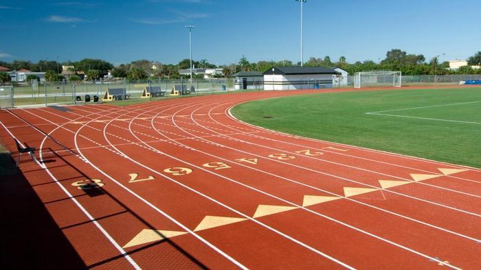 Imran goes to his local athletics track to train for the race. 1(b) One lap of the track is 400 metres.