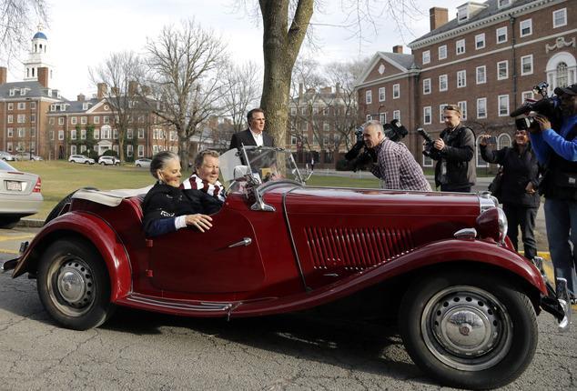 Actors Ali MacGraw and Ryan O'Neal drive up in an antique MG convertible on the campus of Harvard University in Cambridge, Mass., Monday Feb.