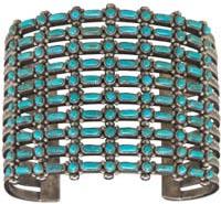 Zuni Bracelet The Zuni learned silversmithing from their Diné (Navajo) neighbors. The Zuni gave greater emphasis to turquoise in their designs.