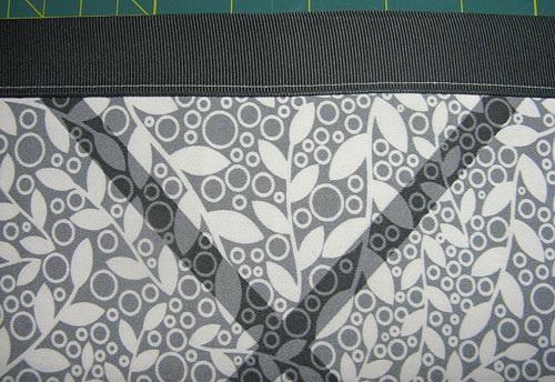 Then, using your see-though ruler, make sure the top folded edge of the pocket piece is parallel with your