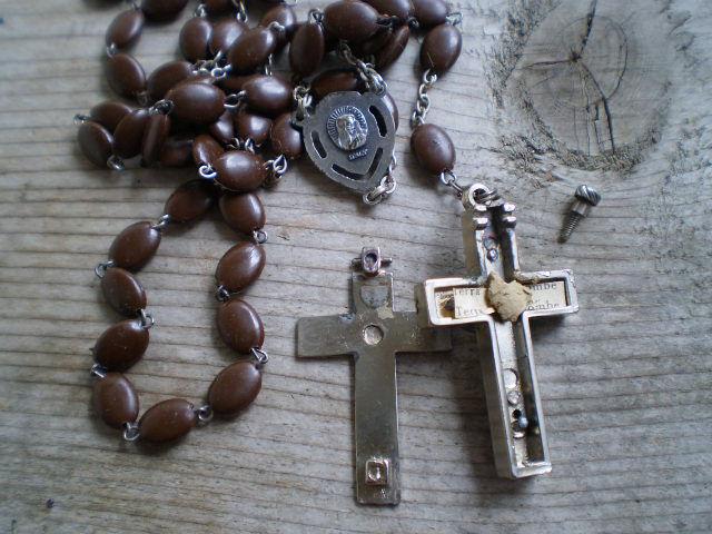 Instead of using the real beads, this rosary has the plastic version- they actually hold up much better tan the authentic beads, as sometimes they have deteriorated with time.