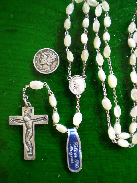 Elegant 800 Silver and Mother of Pearl Vintage French Rosary In new condition with the original tag still in place, this beautifully elegant French rosary is highlighted by a modernist 800