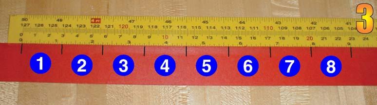 Begin by dividing the circumference of the spindle into eight radial divisions. To do this, wrap a piece of masking tape around the spindle and draw a line across the overlapping pieces (Photo 2).