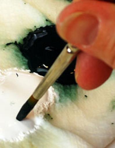 Load the brush with dark green.