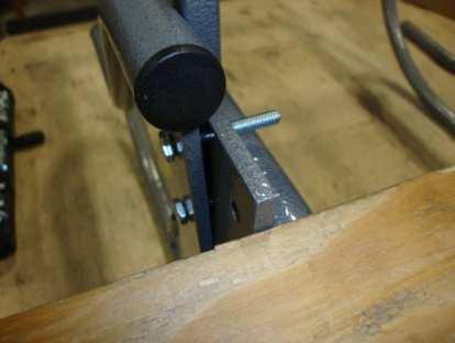 5" from the front caster posts (shown in the pictures is a piece of plywood 2.5" wide to help accurately measure the mounting bracket and keeping it aligned straight.